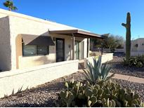 Exterior view of single story home with desert landscaping at 867 E Lancaster Cir, Florence, AZ 85132