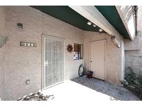 Private front patio with access to building entrance at 10828 N Biltmore Dr # 115, Phoenix, AZ 85029