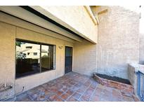 Private patio with tiled flooring and access to the unit at 10828 N Biltmore Dr # 115, Phoenix, AZ 85029
