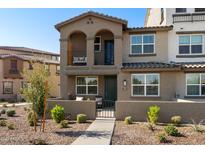 Charming two-story townhome with private front patio and well-maintained landscaping with an upstairs balcony at 1255 N Arizona Ave # 1331, Chandler, AZ 85225