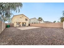 Spacious backyard with gravel and a covered patio at 18963 N Vemto St, Maricopa, AZ 85138