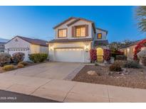 Two-story house with a large garage and landscaped front yard at 26234 W Behrend Dr, Buckeye, AZ 85396