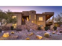 Stunning desert contemporary home with a large covered patio and beautiful landscaping at 4590 S Gold Canyon Dr, Gold Canyon, AZ 85118