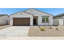 Charming single-story home with a stucco facade, brown trim, desert landscaping, and a two-car garage at 46905 W Old Timer Rd, Maricopa, AZ 85139