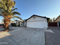 House exterior with driveway and two-car garage at 8537 W Sierra Vista Dr, Glendale, AZ 85305