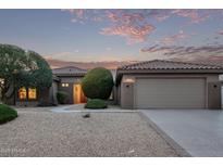 One-story home with a two-car garage and desert landscaping at 17802 N Bridle Ln, Surprise, AZ 85374