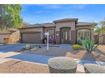 Single-story home with desert landscaping and a two-car garage at 2227 W Calle Del Sol --, Phoenix, AZ 85085