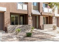 Exterior of a two-story townhome with a modern design and landscaping at 6605 N 93Rd N Ave # 1082, Glendale, AZ 85305