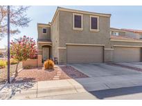 Two-story house with two-car garage, landscaping, and neutral color scheme at 8827 W Dahlia Dr, Peoria, AZ 85381