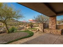 Landscaped backyard oasis with desert plants and mountain views at 10962 E Old Trails Rd, Scottsdale, AZ 85262