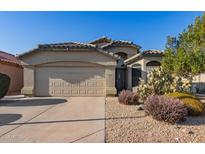 Single-story home with desert landscaping and a two-car garage at 15268 W Melissa Ln, Surprise, AZ 85374