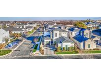 Aerial view of a luxury home community, showcasing a beautiful home with a gray roof and white exterior at 20628 E Natalie Way, Queen Creek, AZ 85142