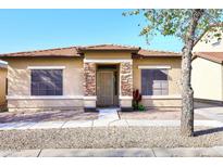 One-story house with stone accents and a landscaped front yard at 234 N Seymour --, Mesa, AZ 85207