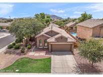 Single-story home with a two-car garage and landscaped front yard at 3471 E Powell Way, Gilbert, AZ 85298