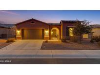 Attractive single-story home with a two-car garage and landscaped front yard at 41929 W Springtime Rd, Maricopa, AZ 85138