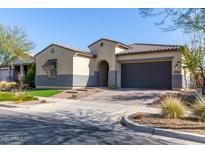 Single-story home with a two-car garage and landscaped front yard at 4765 S Pluto --, Mesa, AZ 85212