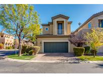 Two-story townhome with a two-car garage and well-manicured landscaping at 5133 N 34Th Pl, Phoenix, AZ 85018