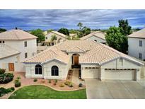 Single-story home with tile roof, and a two-car garage at 854 W Mesquite St, Gilbert, AZ 85233