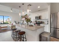 Modern kitchen with stainless steel appliances and an island at 1130 N 2Nd St # 313, Phoenix, AZ 85004