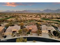 Aerial view of a house in a beautiful golf course community with mountain views at 19771 N 84Th Way, Scottsdale, AZ 85255