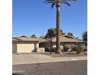 Charming single story home featuring mature landscaping, two car garage and basketball hoop at 2850 E Cortez St, Phoenix, AZ 85028