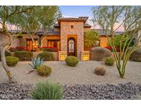 Stunning stone exterior with landscaped desert front yard at 3461 N Ladera Cir, Mesa, AZ 85207