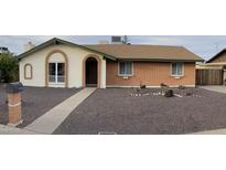 Brick ranch house with a landscaped front yard and walkway at 3506 W Yucca St, Phoenix, AZ 85029