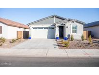 Single-story home with gray exterior, two-car garage, and landscaping at 4342 E Enmark Dr, San Tan Valley, AZ 85143