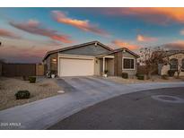 Single-story home with a two-car garage and landscaped front yard at 10806 W King St, Avondale, AZ 85323