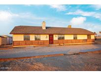 Ranch style home with brick accents and a spacious yard at 22352 W Meade Ln, Buckeye, AZ 85326