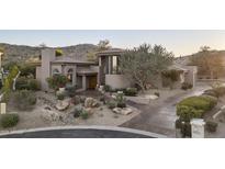 Charming single-story home featuring a desert landscape, mature trees, and covered entry at 3439 E Tonto Dr, Phoenix, AZ 85044