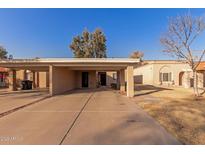 Tan colored exterior with carport and small front yard at 518 E Colgate Dr, Tempe, AZ 85283