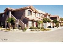 Spanish style townhome with landscaped grounds and attached garage at 5450 E Mcclellan Rd # 227, Mesa, AZ 85205