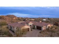 Luxury home with tile roof, large garage, and scenic mountain views at 8519 E Regina Cir, Mesa, AZ 85207