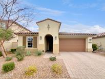 Attractive single-story home with a two-car garage and well-manicured landscaping at 10211 E Wavelength Ave, Mesa, AZ 85212