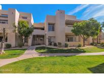 Front view of a two-story building with landscaping and walkway at 11333 N 92Nd St # 2061, Scottsdale, AZ 85260