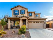 Two-story house with neutral exterior, landscaped yard, and attached garage at 1625 W Cool Water Way, San Tan Valley, AZ 85144