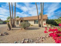 Single-story home with desert landscaping and a large front yard at 18449 N 46Th Ave, Glendale, AZ 85308