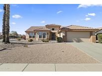 Charming single-story home featuring a tile roof, neutral stucco, desert landscaping, and an attached two-car garage at 23114 N 146Th Dr, Sun City West, AZ 85375