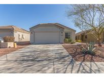 Single-story home with a two-car garage and desert landscaping at 23625 N El Frio Ct, Sun City, AZ 85373