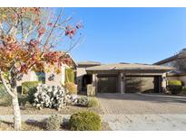 Charming home featuring a three-car garage, desert landscaping, and a welcoming facade at 350 W Yellowstone Way, Chandler, AZ 85248