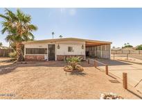 Ranch-style home with carport and desert landscaping at 355 S 58Th St, Mesa, AZ 85206