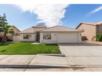 Single-story home with a two-car garage and well-manicured lawn at 3743 W Shannon St, Chandler, AZ 85226