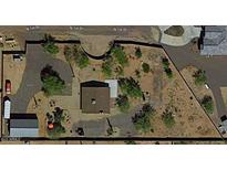 Aerial view showing a house with a large backyard and surrounding desert landscape at 44311 N 1St Dr, New River, AZ 85087