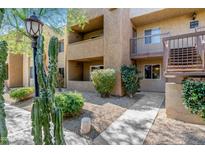 Attractive condo exterior with walkway and landscaping at 5877 N Granite Reef Rd # 1160, Scottsdale, AZ 85250