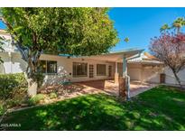 Back patio with access to the backyard and a covered sitting area at 7663 E Coolidge St, Scottsdale, AZ 85251