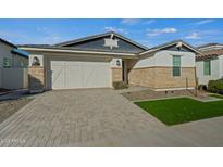 One-story home with stone accents and a two-car garage at 11444 N Northfield St, Surprise, AZ 85388