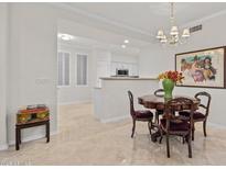 Elegant dining area featuring a classic wood table and chairs at 15221 N Clubgate Dr # 1141, Scottsdale, AZ 85254