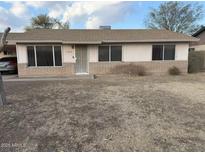 Ranch-style home with front yard and metal security door at 2306 E Cairo Dr, Tempe, AZ 85282