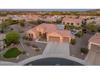 Single-story home with pool and solar panels, in a residential community at 26324 W Yukon Ct, Buckeye, AZ 85396